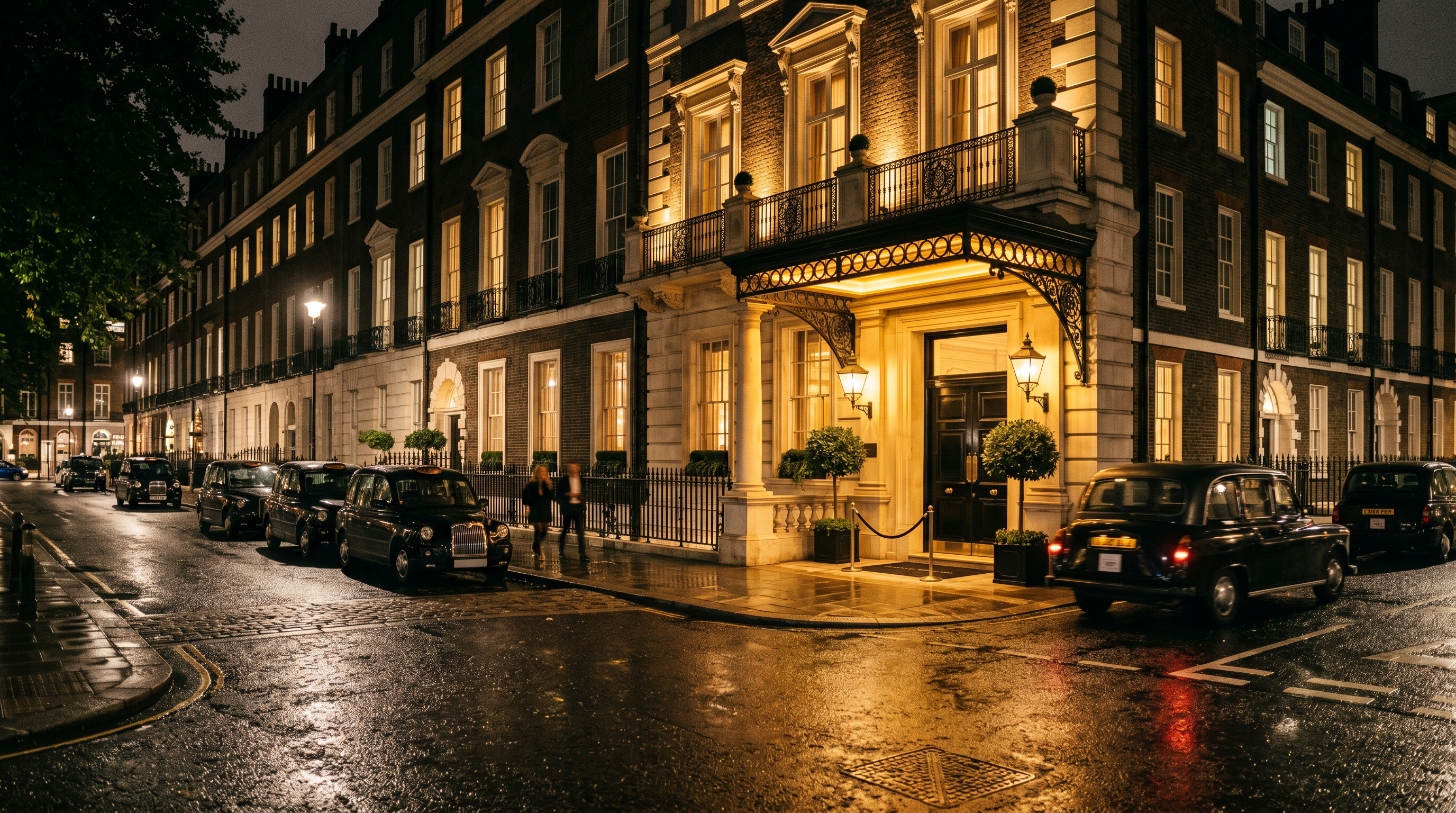 Exterior facade of BestRankedUK boutique hotel at night in Mayfair London